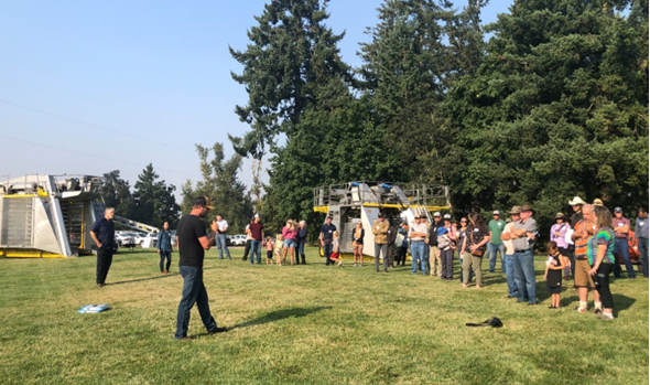 several people standing in a field