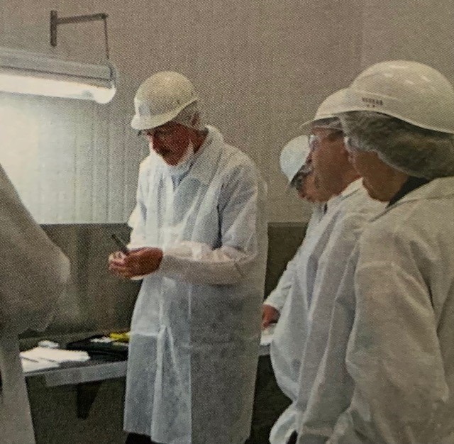 Discussing butter samples at a USDA grading clinic