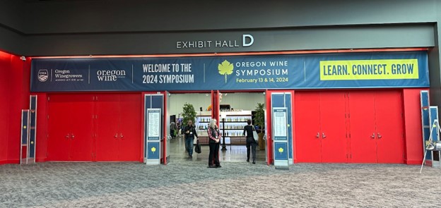 women standing in front of exhibit hall